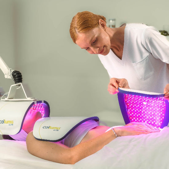 Person receiving LED therapy treatment with a device 